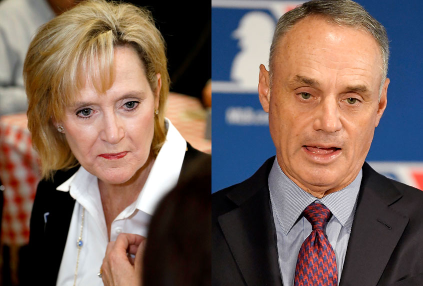 Cindy Hyde-Smith; Rob Manfred (AP/Rogelio V. Solis/Mark J. Terrill)