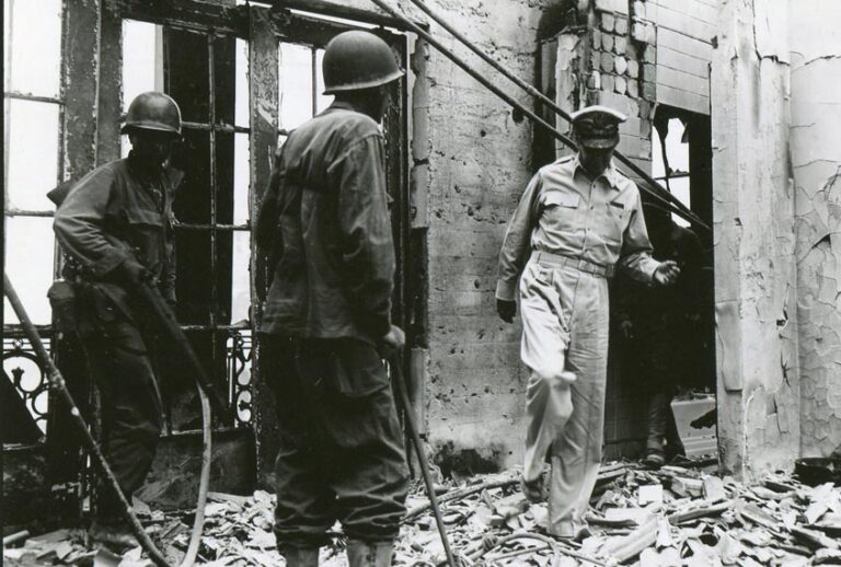 Amid the fighting for the Walled City, MacArthur returns to the ruins of his home atop the once-luxurious Manila Hotel on February 23, 1945. (National Archives)