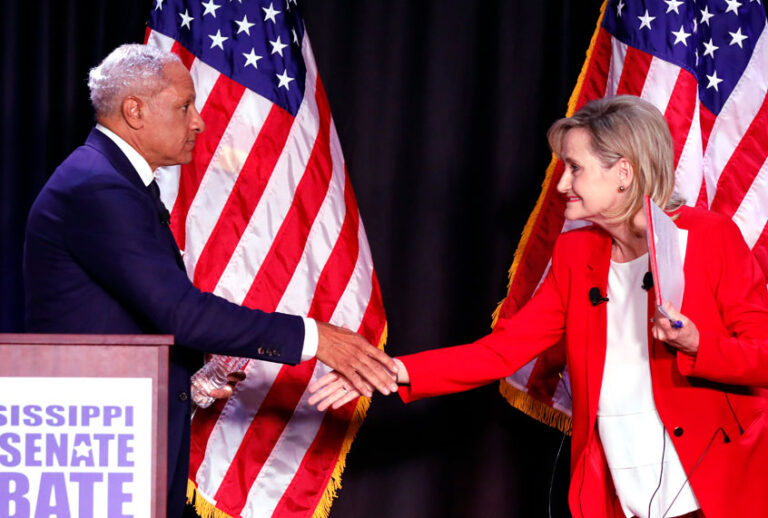 Democrat Mike Espy and appointed U.S. Sen. Cindy Hyde-Smith shake hands following their televised Mississippi U.S. Senate debate in Jackson, Miss., Nov. 20, 2018. (AP/Rogelio V. Solis)