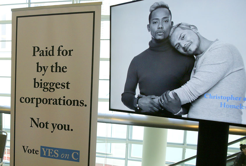 Signs urge support for Proposition C at a SPUR luncheon in San Francisco. (AP/Eric Risberg)