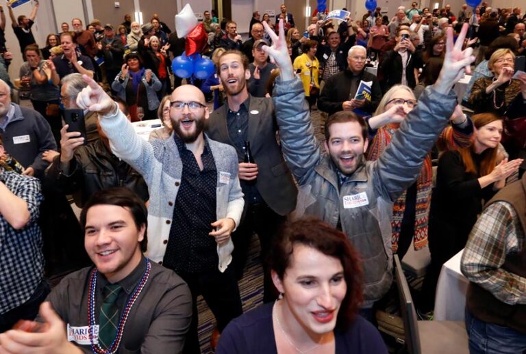 supporters for Democrat House candidate Sharice Davids react to election returns during a watch party in Olathe, Kan. (AP/Colin E. Braley)
