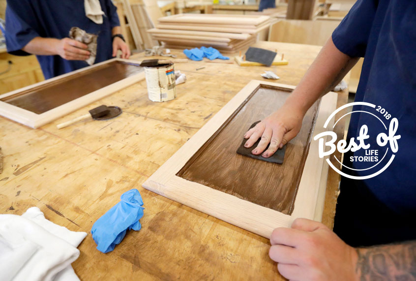 Inmates work on staining cabinet doors at the Habitat for Humanity Prison Build at the Ionia Correctional Facility in Ionia, Mich. (AP/Carlos Osorio)