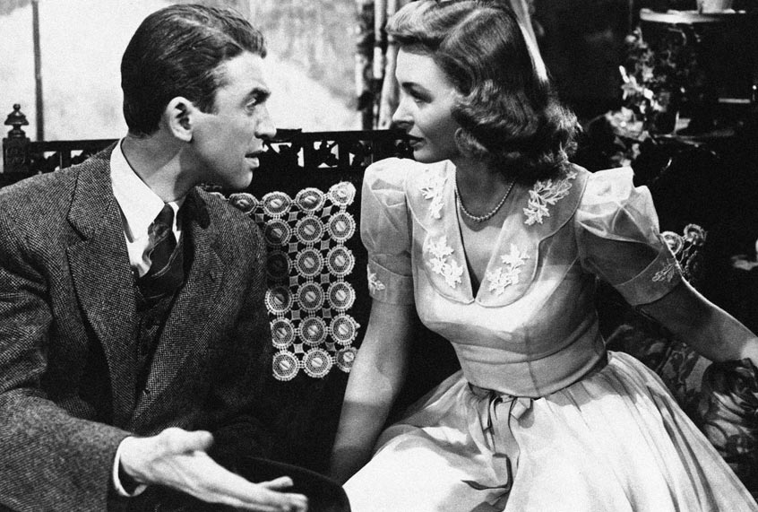 Jimmy Stewart explains things to Donna Reed in “It’s a Wonderful Life” (AP Photo)