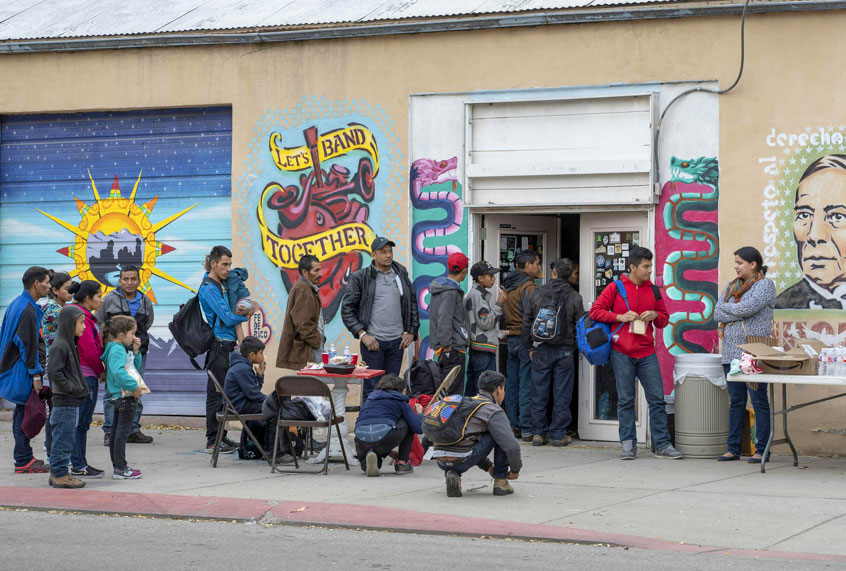 Central American migrants are given food at The Rockhouse Cafe and Gallery after being dropped off in downtown El Paso by Immigration and Customs Enforcement on Christmas day, December 25, 2018. (Getty/Paul Ratje)
