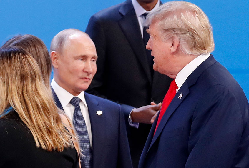 Vladimir Putin and Donald Trump as they gather for the group photo at the start of the G20 summit in Buenos Aires, Argentina, Friday, Nov. 30, 2018. (AP/Pablo Martinez Monsivais)