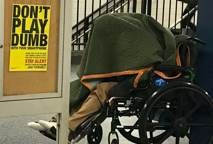 2018 XMAS Time In NYC- The subway offers a warm sanctuary to the record number of tens  thousands of homeless people in various states of deteriorating health who move about in the margins mostly ignored. (Bob Hennelly)
