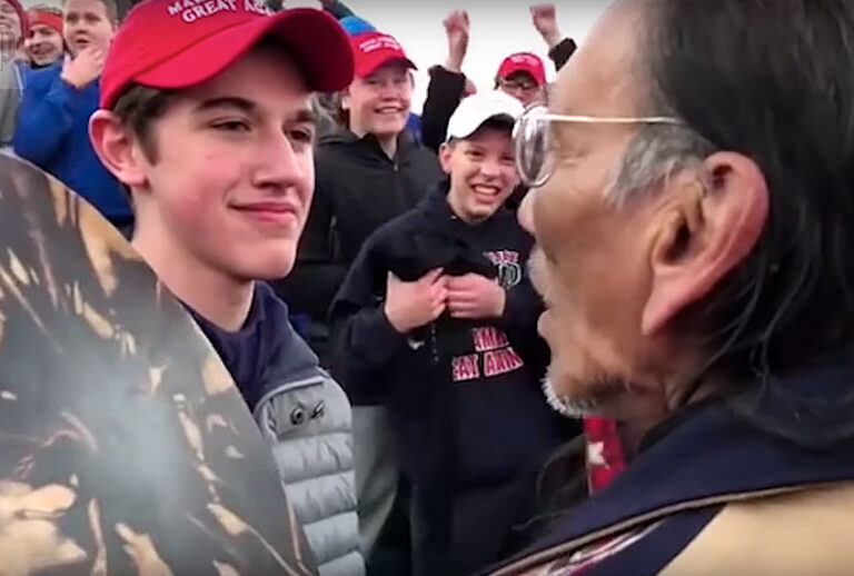 High school student Nick Sandmann and Native American elder Nathan Phillips (YouTube/Washington Post)