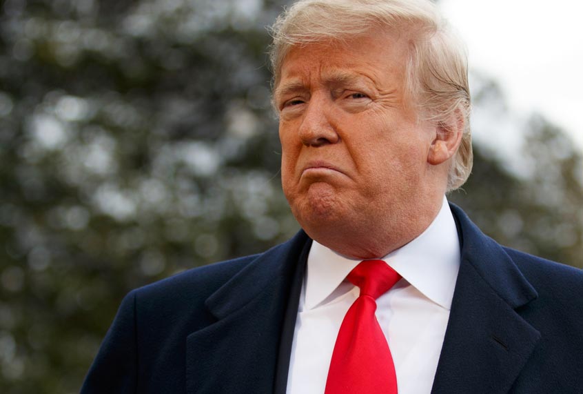 Donald Trump talks with reporters on the South Lawn of the White House before departing for the American Farm Bureau Federation's 100th Annual Convention in New Orleans, Monday, Jan. 14, 2019, in Washington. (AP/Evan Vucci)