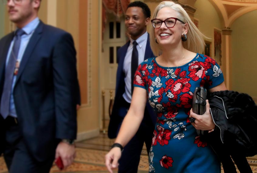Sen. Kyrsten Sinema leaves the Senate floor on Capitol Hill in Washington. (AP/Manuel Balce Ceneta)