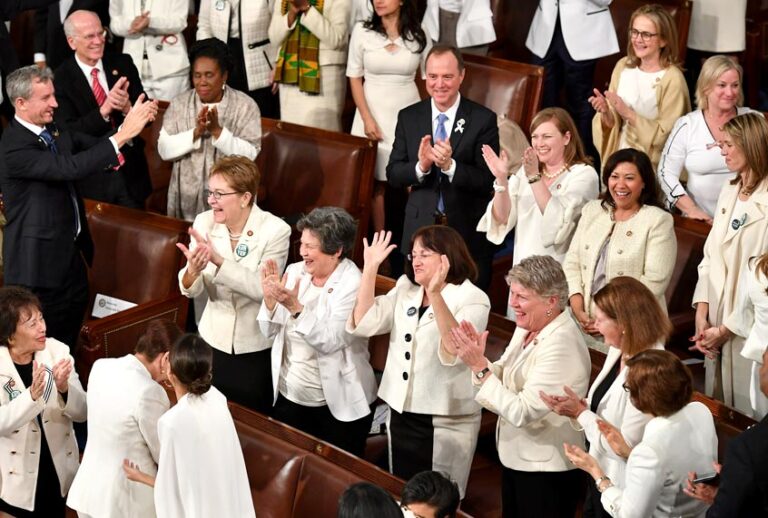 Congresswomen, dressed in white in tribute to the women's suffrage movement, applaud as they attend the State of the Union address at the US Capitol in Washington, DC, on February 5, 2019. (Getty/Mandel Ngan)