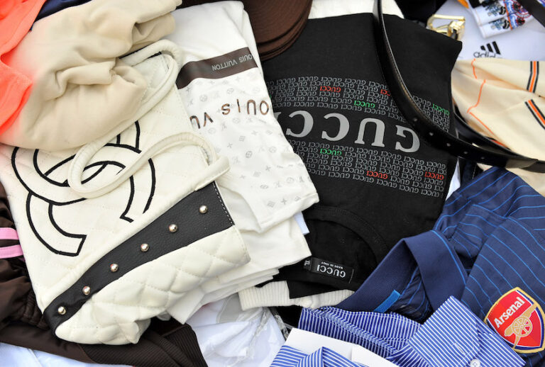 Counterfeit handbags and shirts seized by Customs are displayed at Ministere des Finances on April 22, 2010 in Paris, France. (Photo by Pascal Le Segretain/Getty Images)