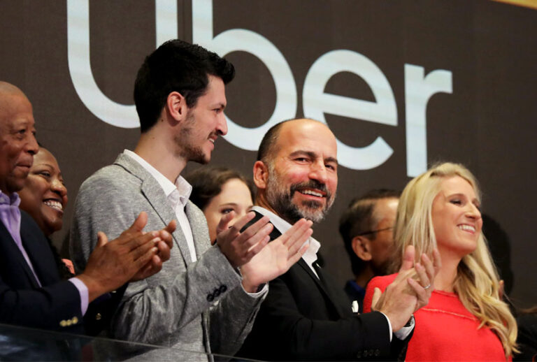 Uber CEO Dara Khosrowshahi (center) joins other employees in ringing the Opening Bell at the New York Stock Exchange (NYSE) as the ride-hailing company Uber makes its highly anticipated initial public offering (IPO) on May 10, 2019 in New York City. (Getty/Spencer Platt)