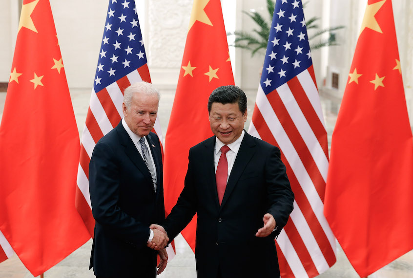 Chinese President Xi Jinping (R) shake hands with U.S Vice President Joe Biden (L) inside the Great Hall of the People on December 4, 2013 in Beijing, China. (Lintao Zhang/Getty Images)