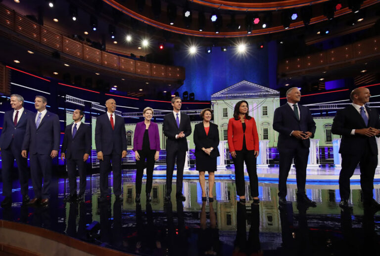 Democratic presidential candidates New York City Mayor Bill De Blasio (L-R), Rep. Tim Ryan (D-OH), former housing secretary Julian Castro, Sen. Cory Booker (D-NJ), Sen. Elizabeth Warren (D-MA), former Texas congressman Beto O'Rourke, Sen. Amy Klobuchar (D-MN), Rep. Tulsi Gabbard (D-HI), Washington Gov. Jay Inslee, and former Maryland congressman John Delaney take the stage during the first night of the Democratic presidential debate on June 26, 2019 in Miami, Florida. (Getty/Drew Angerer)