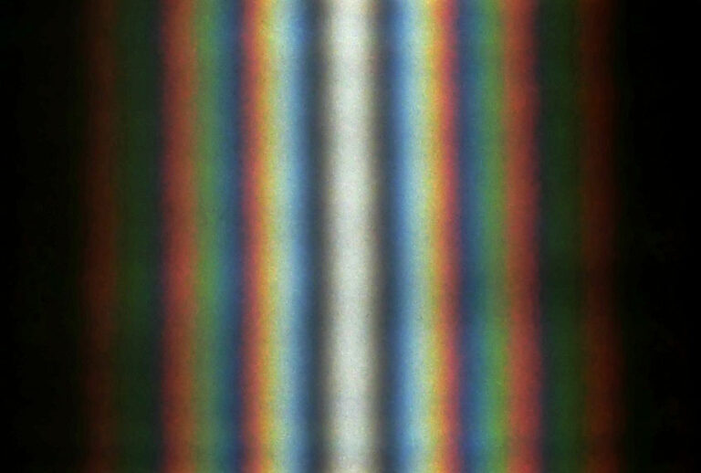 A double-slit interference of the sunlight passing through two slits ~1 cm long and ~0.5 mm apart. (Wikimedia/Aleksandr Berdnikov)