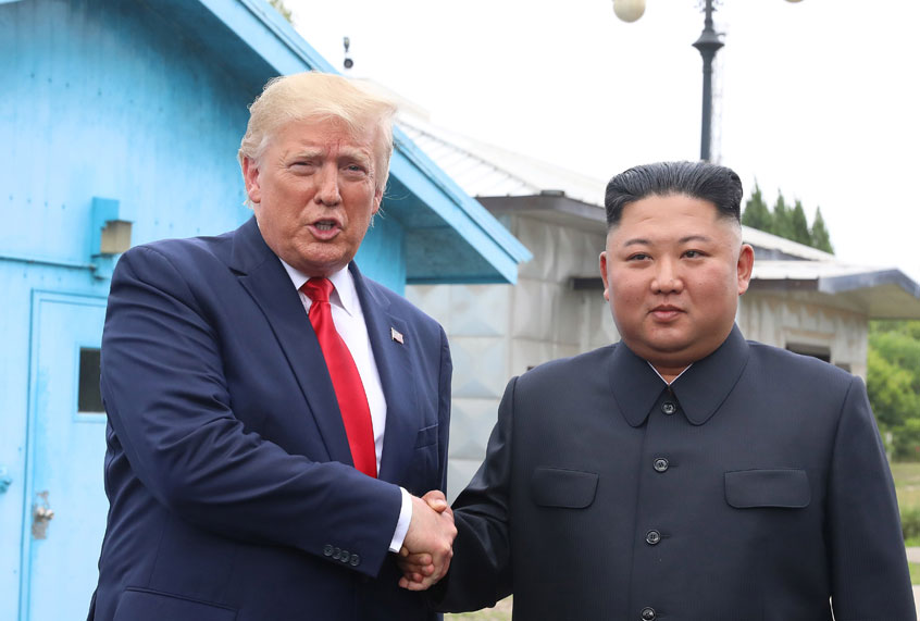 A handout photo provided by Dong-A Ilbo of North Korean leader Kim Jong Un and U.S. President Donald Trump inside the demilitarized zone (DMZ) separating the South and North Korea on June 30, 2019 in Panmunjom, South Korea. (Handout photo by Dong-A Ilbo via Getty Images)