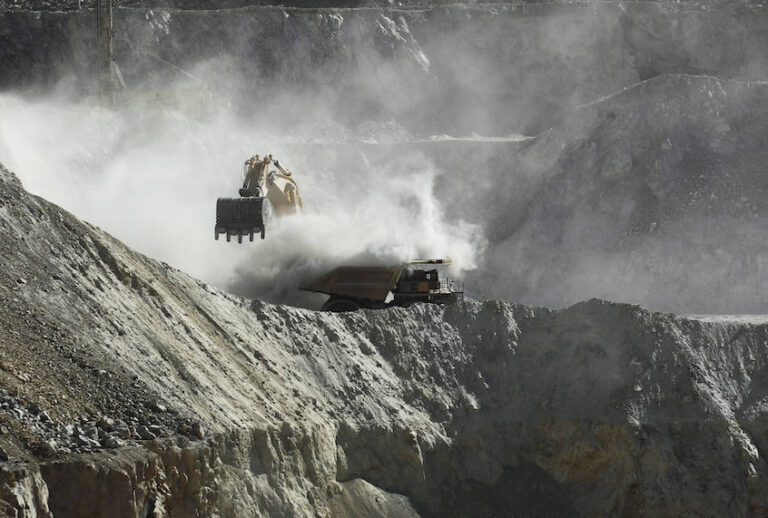 In this Sept. 25, 2012 photo, a bulldozer works at the Chuquicamata copper mine in the Atacama desert in northern Chile. (AP Photo/Jorge Saenz)