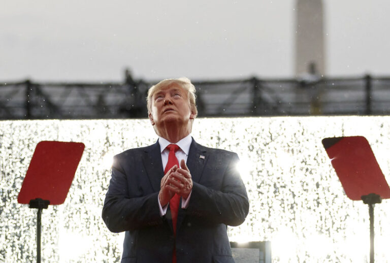 President Donald Trump looks up during the military flyovers at the Independence Day celebration in front of the Lincoln Memorial, Thursday, July 4, 2019, in Washington. (AP/Carolyn Kaster)