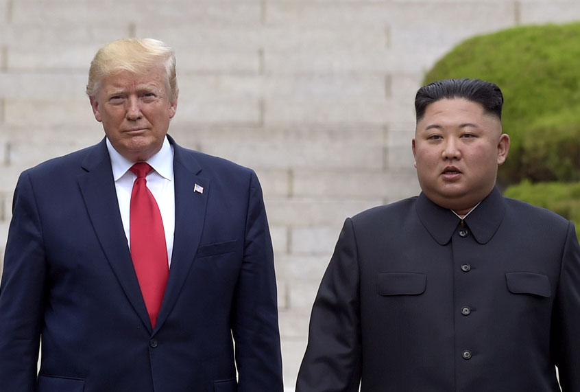 President Donald Trump meets with North Korean leader Kim Jong Un at the North Korean side of the border at the village of Panmunjom in Demilitarized Zone, Sunday, June 30, 2019. (AP/Susan Walsh)