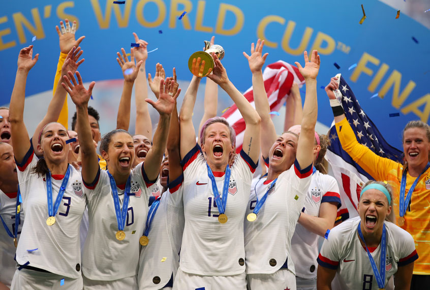 Megan Rapinoe of the USA lifts the FIFA Women's World Cup Trophy following her team's victory in the 2019 FIFA Women's World Cup France Final match between The United States of America and The Netherlands at Stade de Lyon on July 07, 2019 in Lyon, France. (Getty/Richard Heathcote)