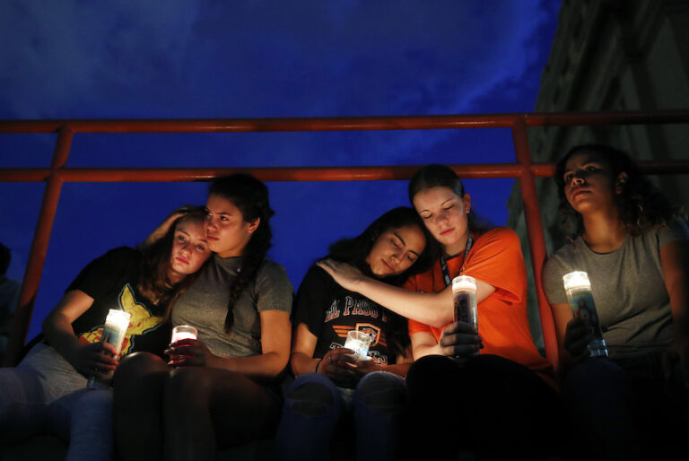 From left, Melody Stout, Hannah Payan, Aaliyah Alba, Sherie Gramlich and Laura Barrios comfort each other during a vigil for victims of the shooting Saturday, Aug. 3, 2019, in El Paso, Texas. (AP/John Locher)