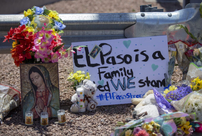 Flowers and a Virgin Mary painting adorn makeshift memorial for the victims of Saturday mass shooting at a shopping complex in El Paso, Texas, Sunday, August 4, 2019. (AP/Andres Leighton)