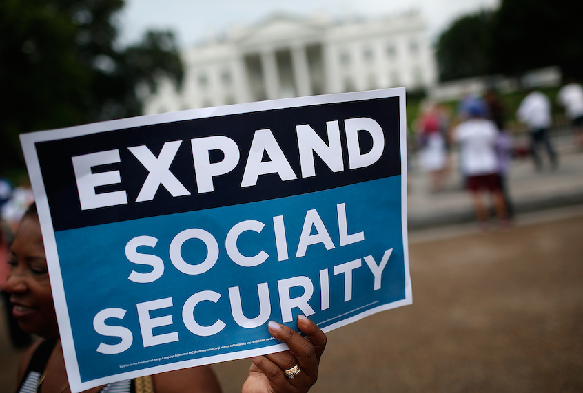 Activists participate in a rally urging the expansion of Social Security benefits in front of the White House July 13, 2015 in Washington, DC. (Win McNamee/Getty Images)