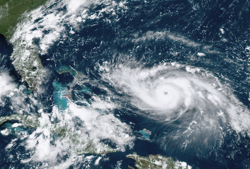 This GOES-16 satellite image taken Friday, Aug. 30, 2019, at 17:20 UTC and provided by National Oceanic and Atmospheric Administration (NOAA), shows Hurricane Dorian, right, moving over open waters in the Atlantic Ocean. Forecasters are now saying Dorian could be a Category 4 with winds of nearly 140 mph (225 kph) when it is forecasted to hit Florida late Monday or early Tuesday. It’s also imperiling the Bahamas, where the storm is expected to hit by Sunday. (NOAA via AP) (AP)