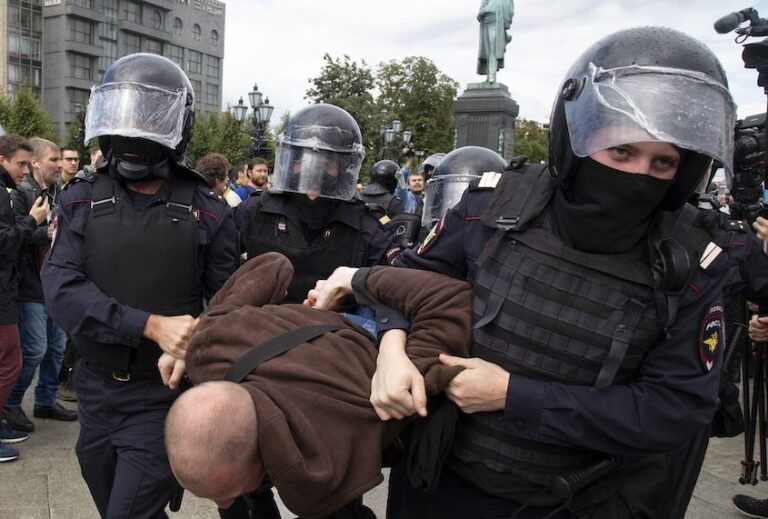 Police officers detain a protestor, during an unsanctioned rally in Pushkin Square in Moscow, Russia, Saturday, Aug. 3, 2019. (AP/Alexander Zemlianichenko)