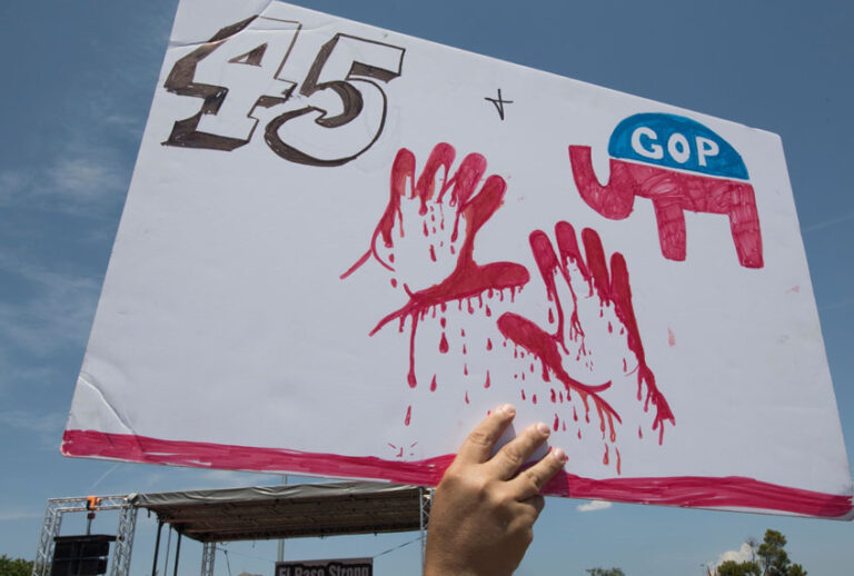 El Paso residents protest against the visit of US President Donald Trump to the city after the Walmart shooting that left a total of 22 people dead, in El Paso, Texas, on August 7, 2019. (Getty/Mark Ralston)