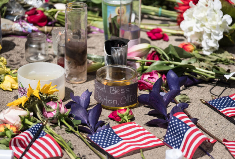 Candles and flowers a placed in front of Ned Peppers bar after the mass shooting over the weekend in Dayton, Ohio on August 5, 2019. (Getty/MEGAN JELINGER)