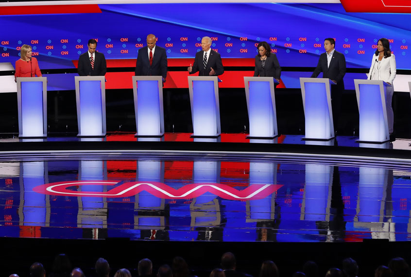 Sen. Kirsten Gillibrand (D-NY), former Housing and Urban Development Secretary Julian Castro, Sen. Cory Booker (D-NJ), former Vice President Joe Biden, Sen. Kamala Harris (D-CA), Andrew Yang, and Rep. Tulsi Gabbard (D-HI) participate in the second of two Democratic presidential primary debates hosted by CNN Wednesday, July 31, 2019, in the Fox Theatre in Detroit. (AP/Paul Sancya)