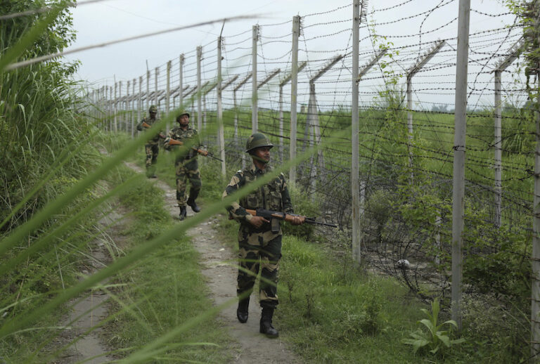 India’s Border Security Force (BSF) soldiers patrol near the India-Pakistan international border fencing at Garkhal in Akhnoor, 35 kilometers (22 miles) west of Jammu, India, Tuesday, Aug.13,2019. (AP Photo/Channi Anand) (AP Photo/Channi Anand)