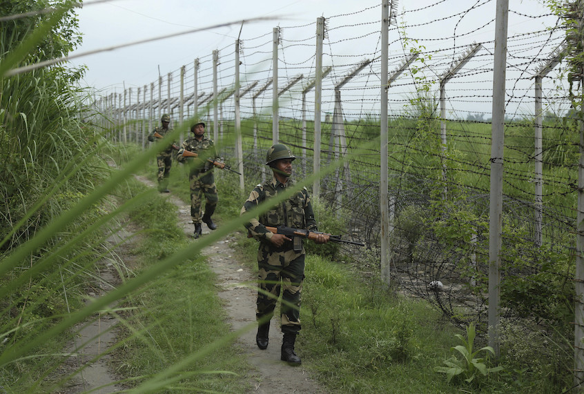 India’s Border Security Force (BSF) soldiers patrol near the India-Pakistan international border fencing at Garkhal in Akhnoor, 35 kilometers (22 miles) west of Jammu, India, Tuesday, Aug.13,2019. (AP Photo/Channi Anand) (AP Photo/Channi Anand)