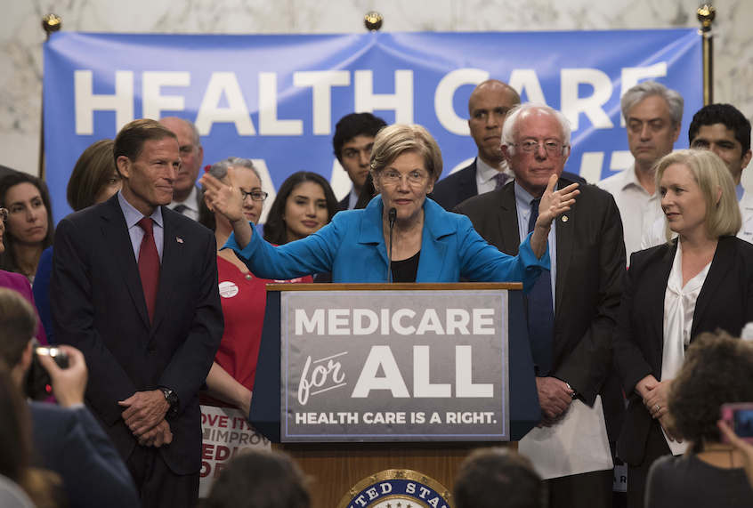 US Senator Elizabeth Warren (C), Democrat from Massachusetts, speaks with US Senator Bernie Sanders (2nd R), Independent from Vermont, as they discusses Medicare for All legislation on Capitol Hill in Washington, DC, on September 13, 2017.  

The former US presidential hopeful introduced a plan for government-sponsored universal health care, a notion long shunned in America that has newly gained traction among rising-star Democrats. / AFP PHOTO / JIM WATSON        (Photo credit should read JIM WATSON/AFP/Getty Images) (Jim Watson/AFP/Getty Images)
