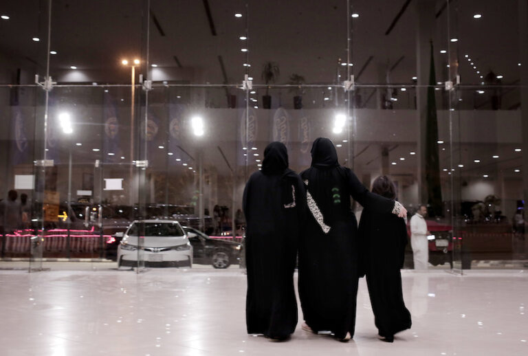 FILE - In this June 21, 2018 file photo, women leave after looking at cars at the Al-Jazirah Ford showroom in Riyadh, Saudi Arabia. Ride-hailing companies Uber and local competitor Careem are hiring female drivers after Saudi Arabia lifted a longstanding ban on women driving. (AP Photo/Nariman El-Mofty, File) (AP Photo/Nariman El-Mofty, File)