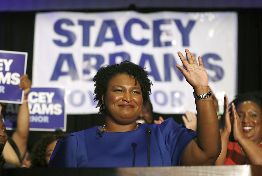 FILE- In this May 22, 2018 file photo Democratic candidate for Georgia Gov. Stacey Abrams waves in Atlanta. Former Vice President Joe Biden is endorsing Abrams Wednesday, June 20, 2018. (AP Photo/John Bazemore)