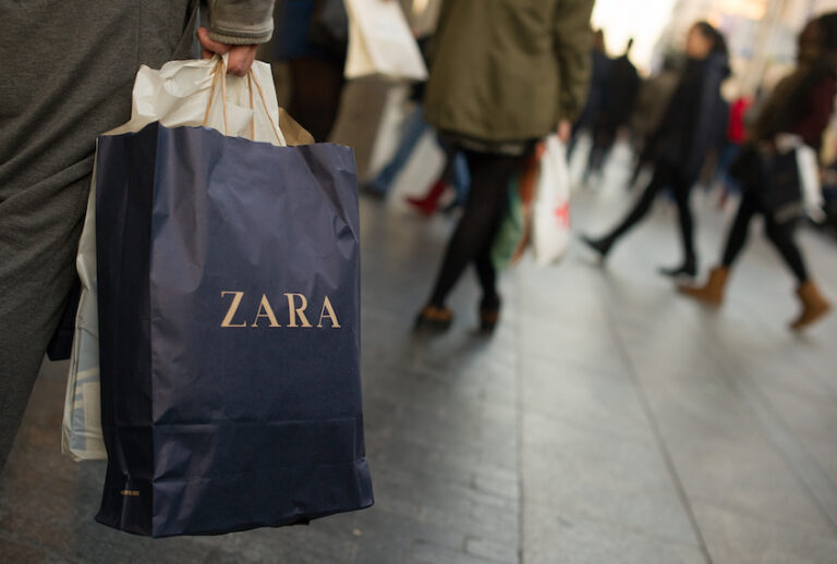 A shopper holds a a branded paper shopping bag from the Zara fashion store on Gran via street on December 19, 2014 in Madrid, Spain. (Denis Doyle/Getty Images)