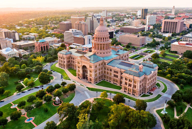 Capitol building, aerial skyline, sunset, Austin, TX, Texas State Capital (Getty Images/ dszc)