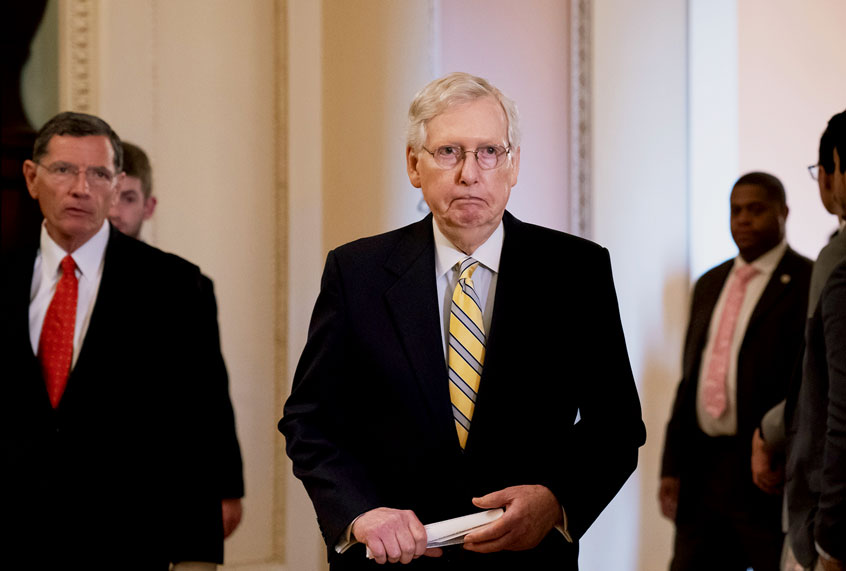Senate Majority Leader Mitch McConnell, R-Ky., joined at left by Sen. John Barrasso, R-Wyo., arrives to speak to reporters during a news conference at the Capitol in Washington, Tuesday, Sept. 17, 2019. (AP Photo/J. Scott Applewhite)