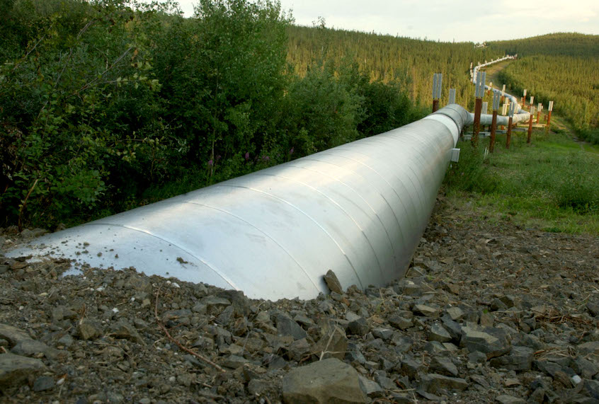 A buried section of the Trans-Alaska Pipeline emerges a few miles north of the Yukon River on July 21, 2002 in Fairbanks, Alaska. (Barry Williams/Getty Images)