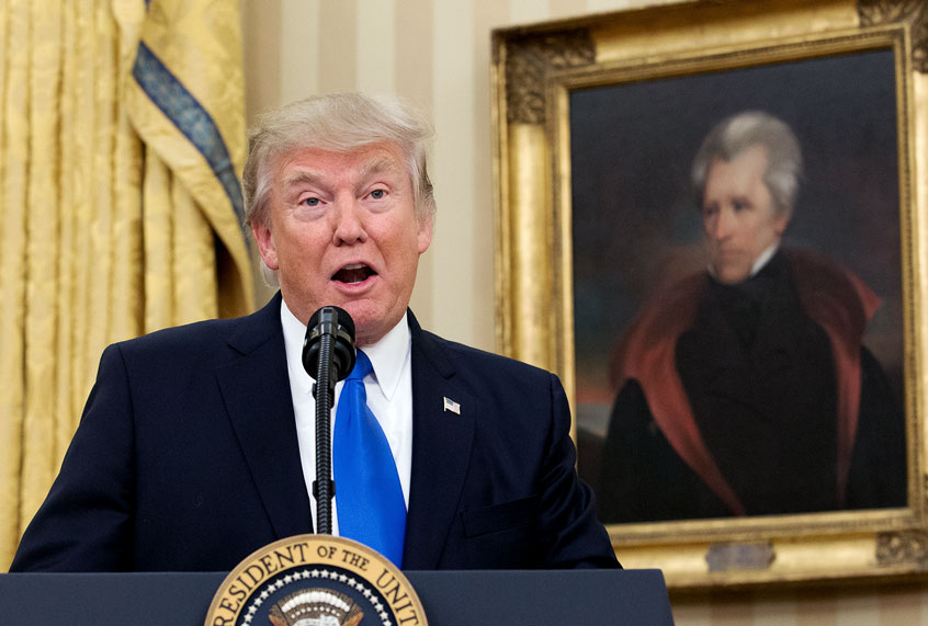 U.S. President Donald Trump, beneath a portrait of populist President Andrew Jackson, speaks before the swearing-in of Rex Tillerson as 69th secretary of state in the Oval Office of the White House on February 1, 2017 in Washington, DC. (Michael Reynolds-Pool/Getty Images)