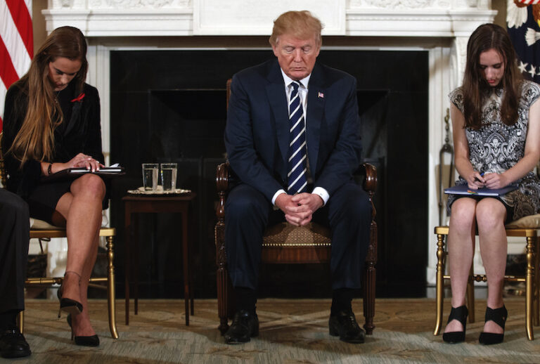 President Trump prayed with two students from Marjory Stoneman Douglas High School in Feb. 21, 2018 before a discussion on gun violence. (AP Photo/Carolyn Kaster)