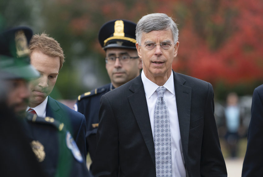 The top U.S. diplomat in Ukraine, William Taylor, is escorted by U.S. Capitol Police as he arrives to testify before House committees as part of the Democrats' impeachment investigation of President Donald Trump. (AP Photo/J. Scott Applewhite)