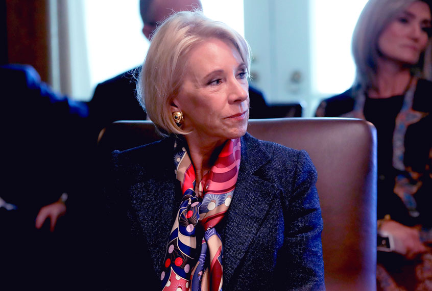 Education Secretary Betsy DeVos listening to President Donald Trump during a Cabinet meeting in the Cabinet Room of the White House, Monday, Oct. 21, 2019, in Washington. (AP Photo/Pablo Martinez Monsivais)