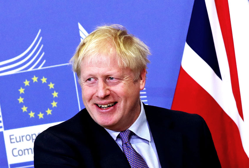 British Prime Minister Boris Johnson at EU headquarters in Brussels, Thursday, Oct. 17, 2019. Britain and the European Union reached a new tentative Brexit deal on Thursday, hoping to finally escape the acrimony, divisions and frustration of their three-year divorce battle. (AP Photo/Francisco Seco)