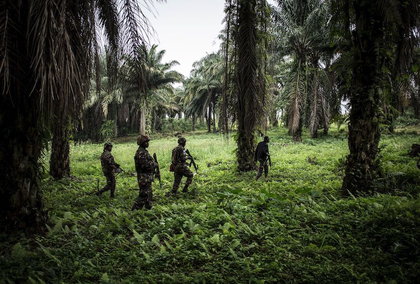 TOPSHOT - A picture taken on November 13, 2018, shows Tanzanian soldiers from the United Nations Organization Stabilization Mission in the Democratic Republic of the Congo (MONUSCO) patroling against Ugandan Allied Democratic Force (ADF) rebels in Beni. - The Beni area has for the last four years been under seige from the ADF, an Islamist armed group that has killed hundreds of people since 2014. (Photo by John WESSELS / AFP)        (Photo credit should read JOHN WESSELS/AFP/Getty Images) (John Wessels/AFP/Getty Images)
