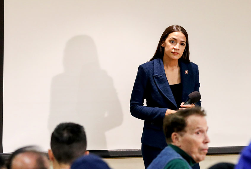 U.S. Rep. Alexandria Ocasio-Cortez (D-NY) takes questions during a town hall meeting at the LeFrak City Queens Library on October 3, 2019 in the Queens borough of New York City. The event focused on her A Just Society legislation, which targets poverty, affordable housing, and access to federal benefits. (Drew Angerer/Getty Images)