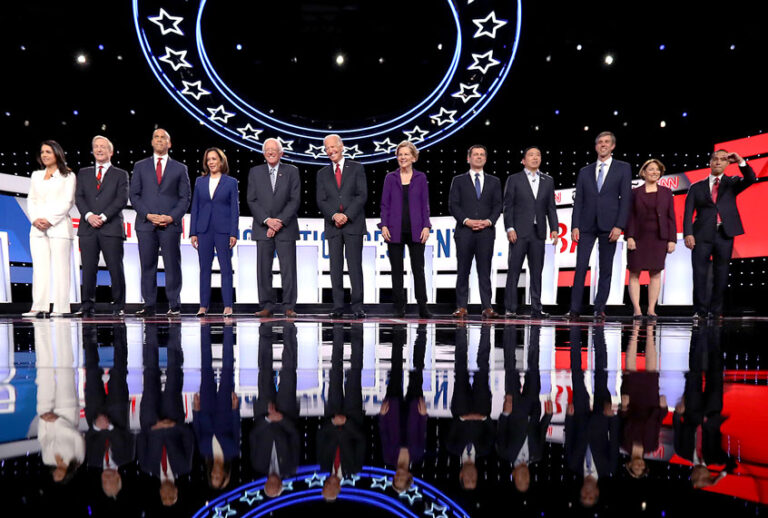 Democratic presidential candidates (L-R) Rep. Tulsi Gabbard (D-HI), billionaire Tom Steyer, Sen. Cory Booker (D-NJ), Sen. Kamala Harris (D-CA), Sen. Bernie Sanders (I-VT), former Vice President Joe Biden, Sen. Elizabeth Warren (D-MA), South Bend, Indiana Mayor Pete Buttigieg, former tech executive Andrew Yang, former Texas congressman Beto O'Rourke, Sen. Amy Klobuchar (D-MN), and former housing secretary Julian Castro at the strart of the Democratic Presidential Debate at Otterbein University on October 15, 2019 in Westerville, Ohio. A record 12 presidential hopefuls are participating in the debate hosted by CNN and The New York Times. (Chip Somodevilla/Getty Images)