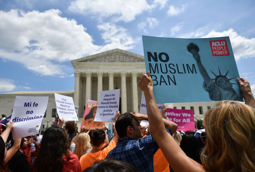 People protest the Muslim travel ban outside of the US Supreme Court in Washington, DC on June 26, 2018. (Mandel Ngan/AFP via Getty Images)